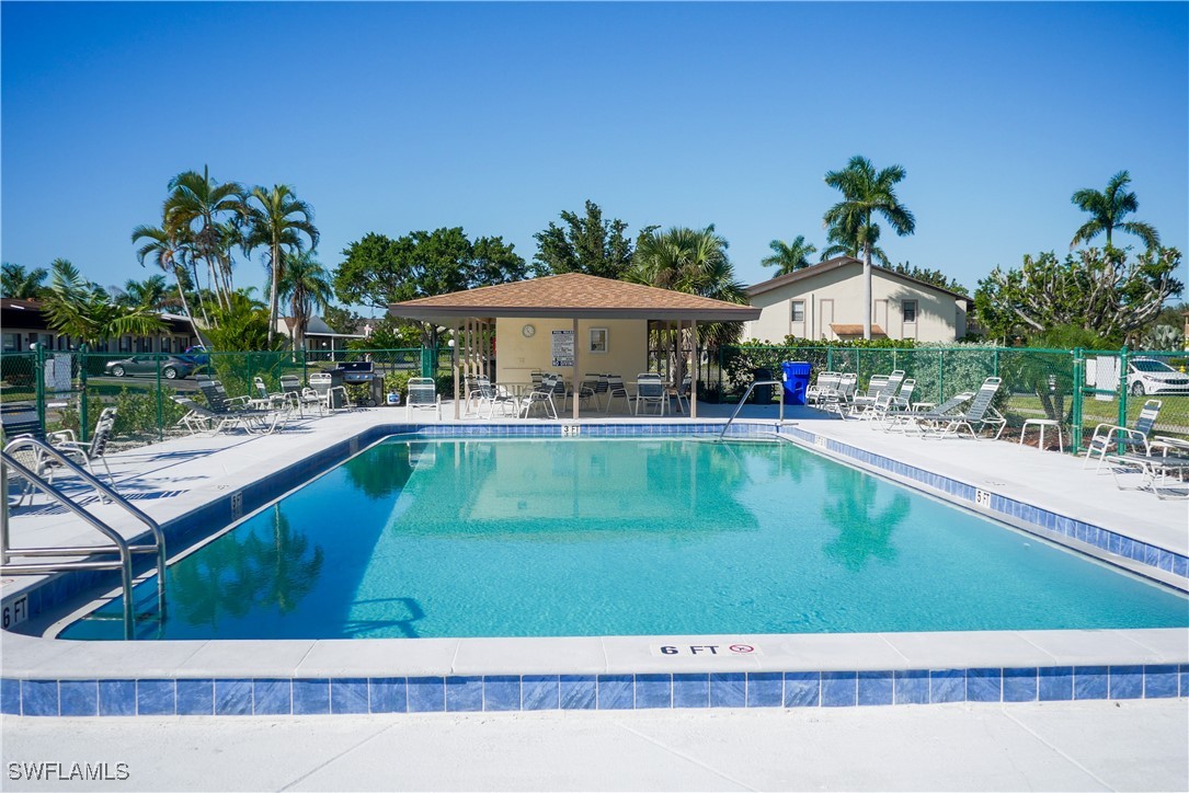 a view of a swimming pool with a patio