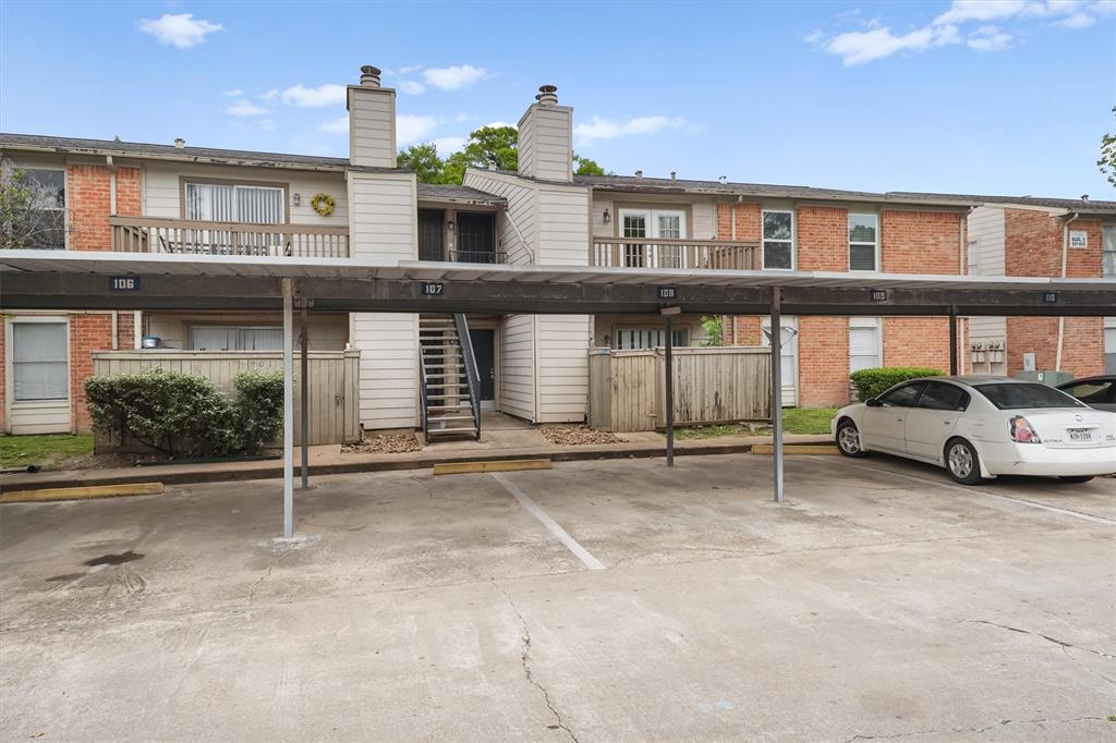 a view of a car park in front of house