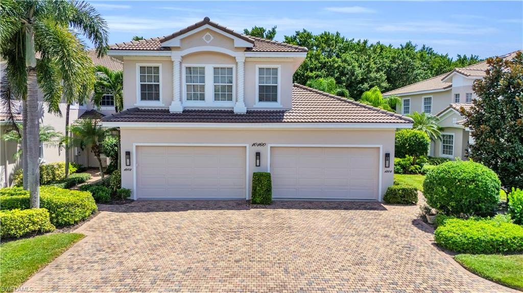 Mediterranean / spanish-style home featuring a garage