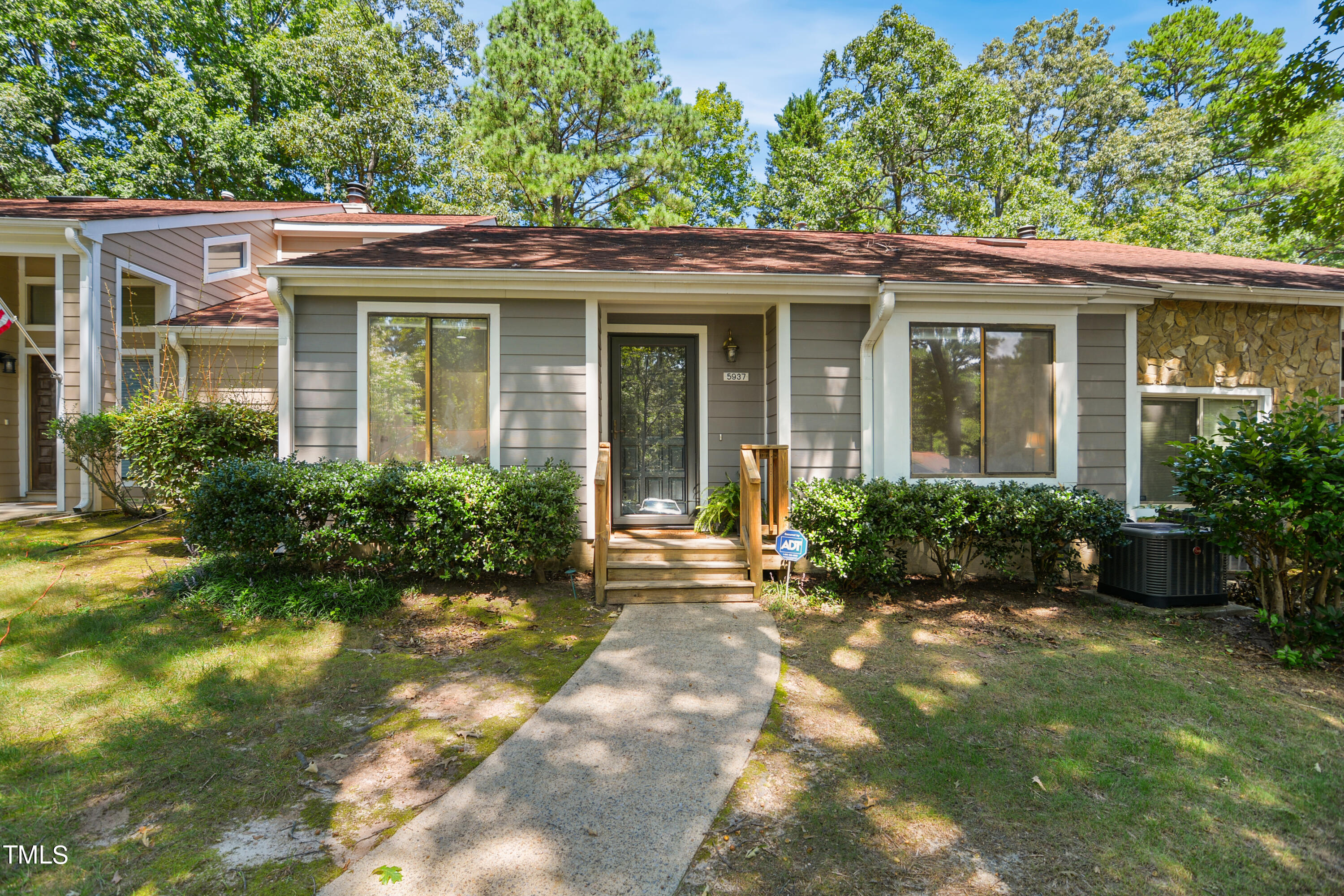 front view of a house with a yard