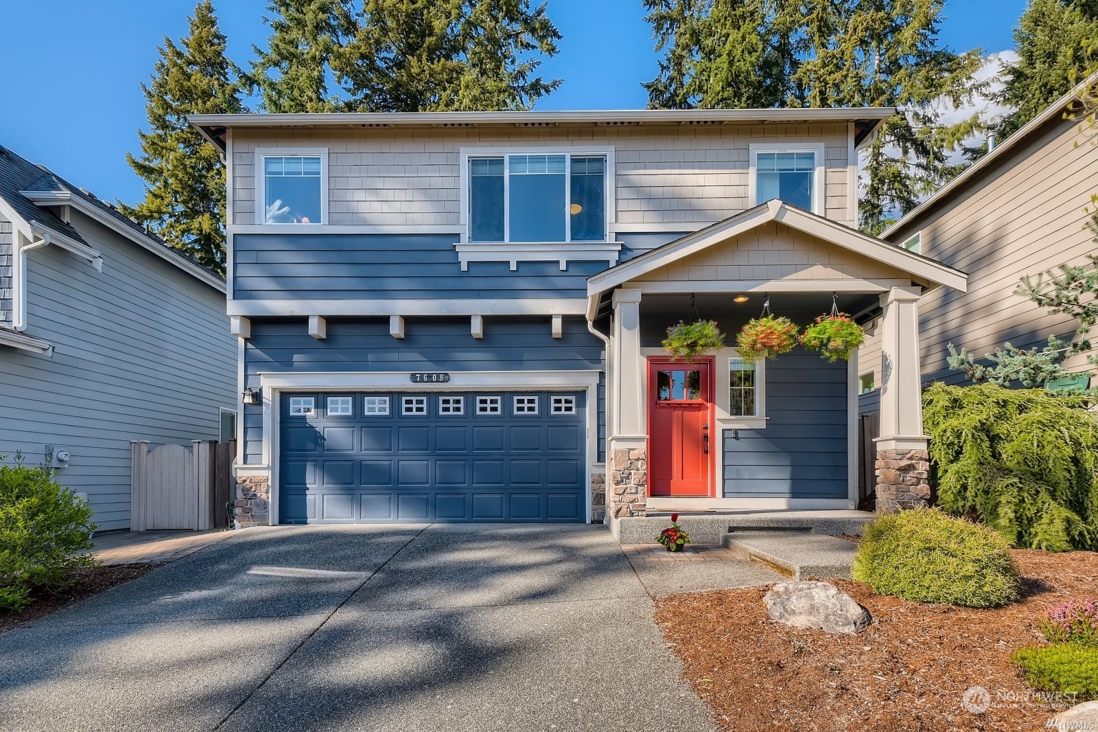 a front view of a house with a garage