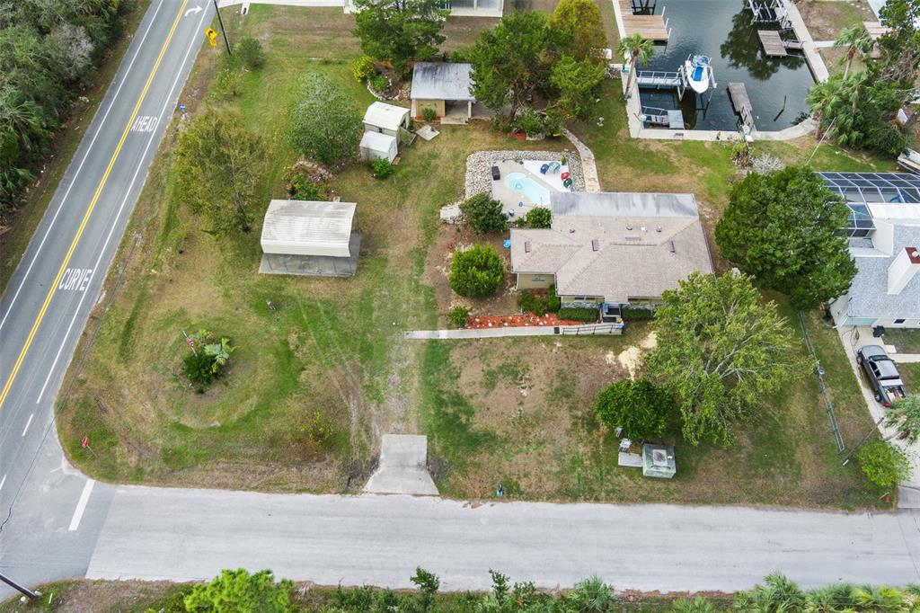 an aerial view of a residential houses with outdoor space