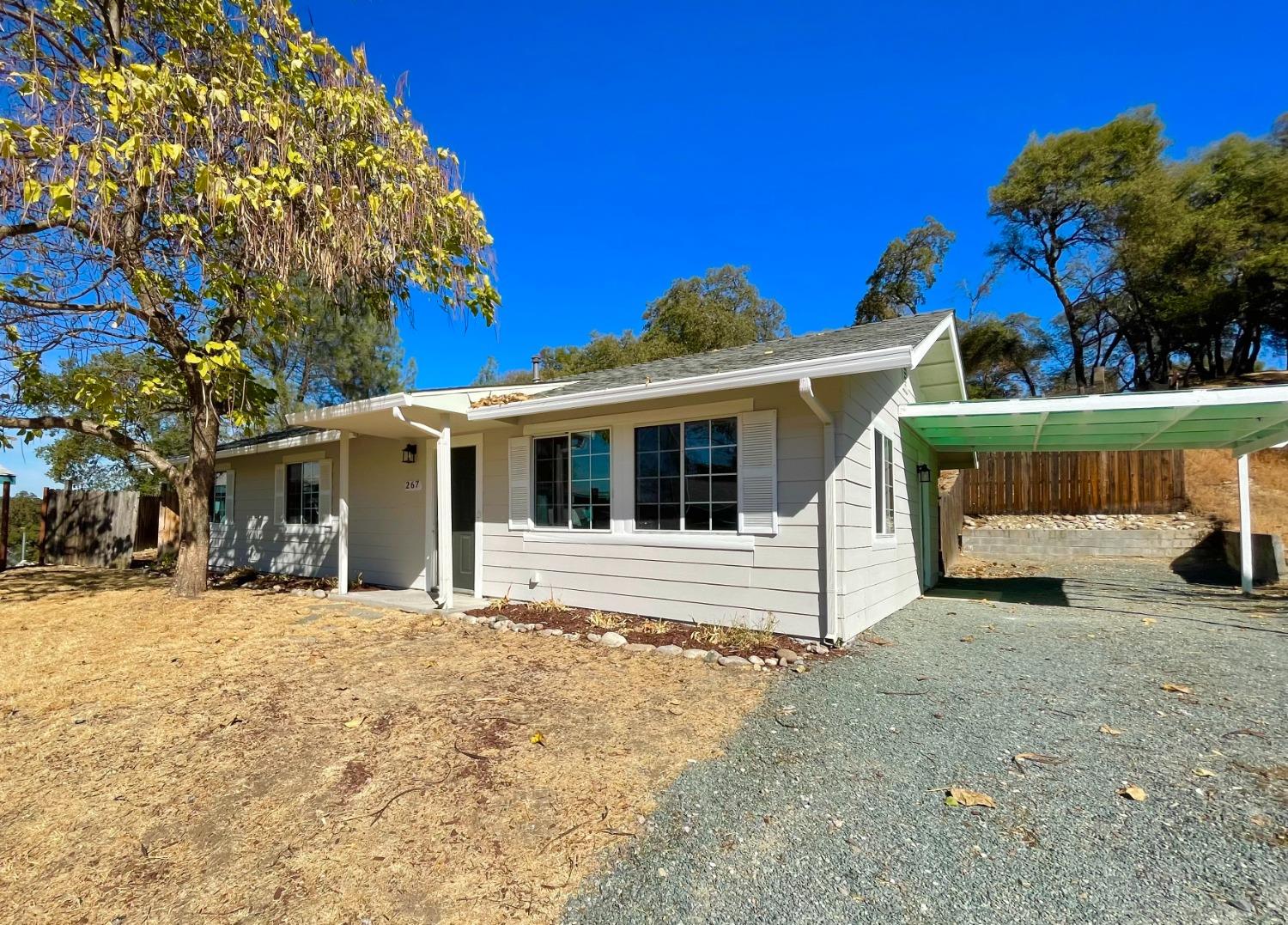 a view of a house with a yard