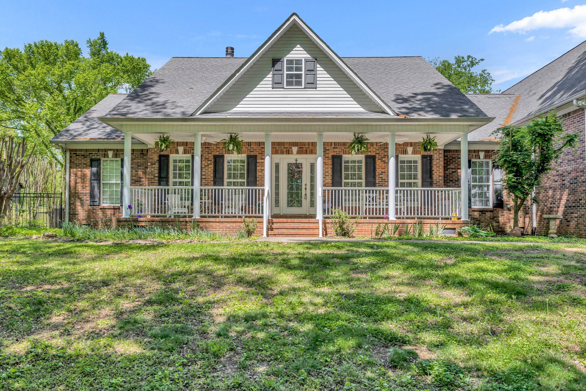 a front view of a house with a yard