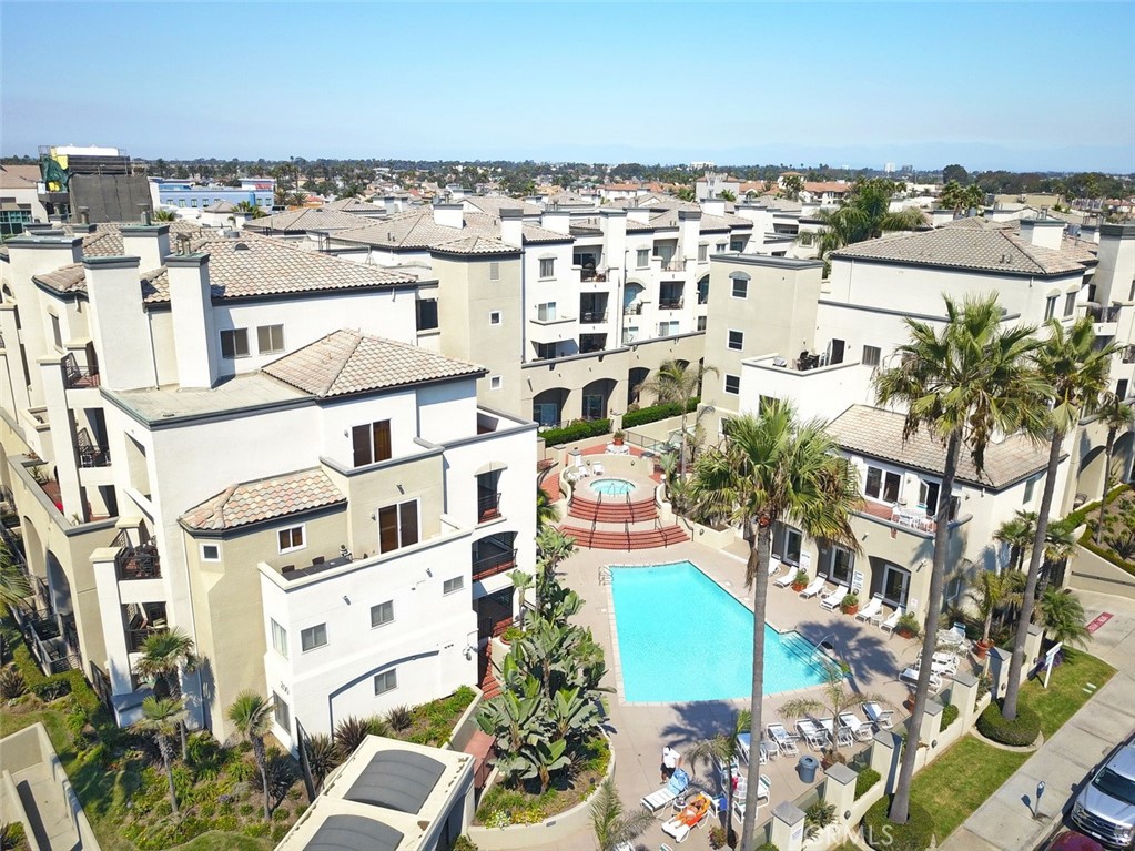 an aerial view of residential building and parking space