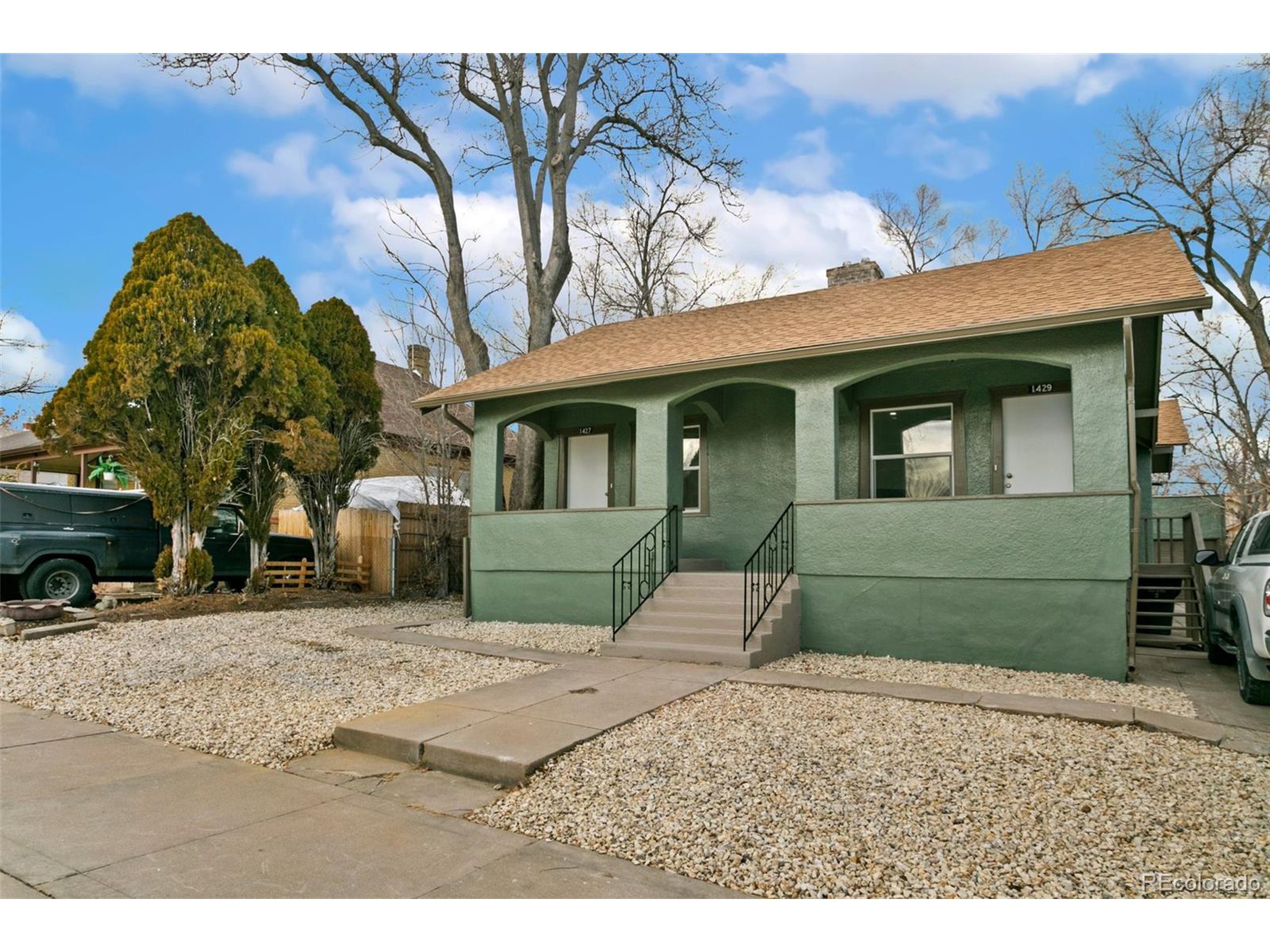 a front view of a house with a yard