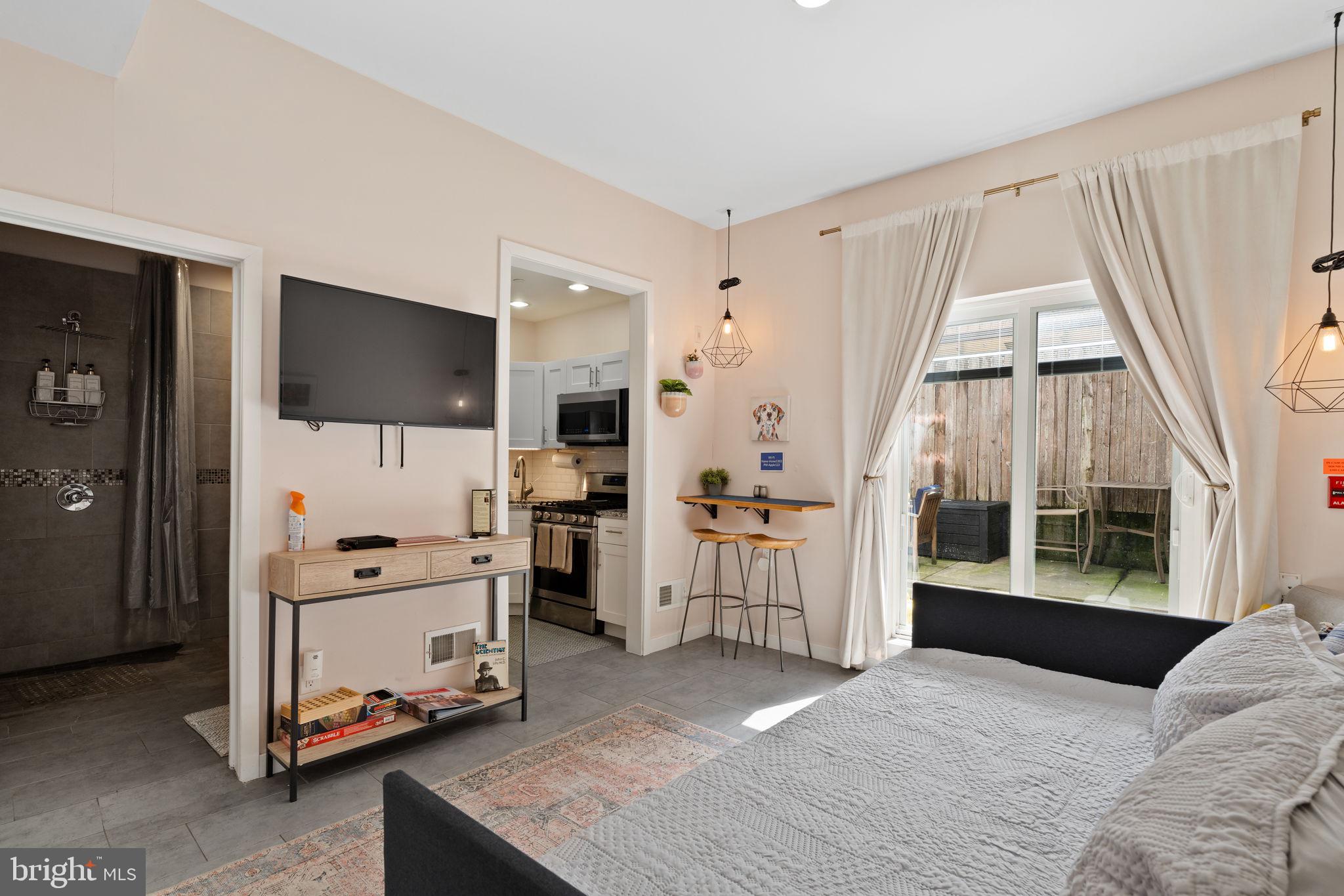 a view of kitchen with furniture and wooden floor