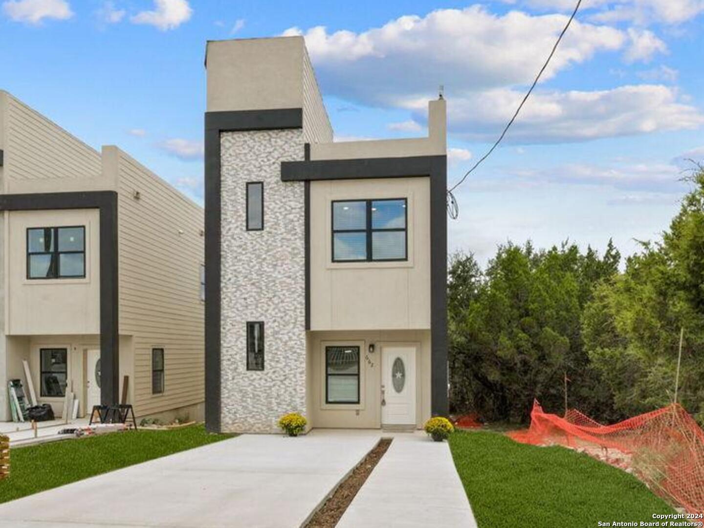 a front view of a house with a yard