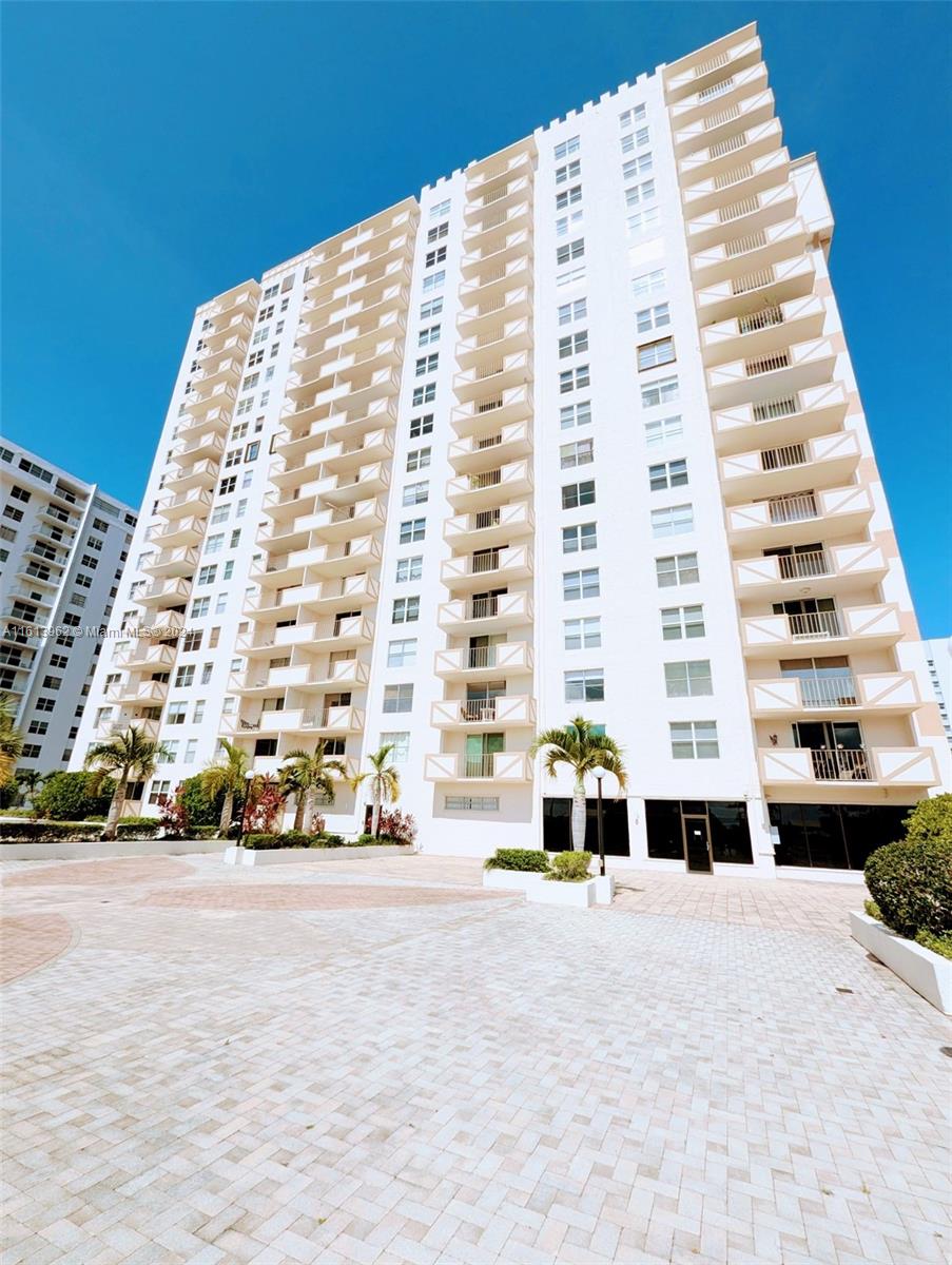 a view of a tall building with a outdoor space