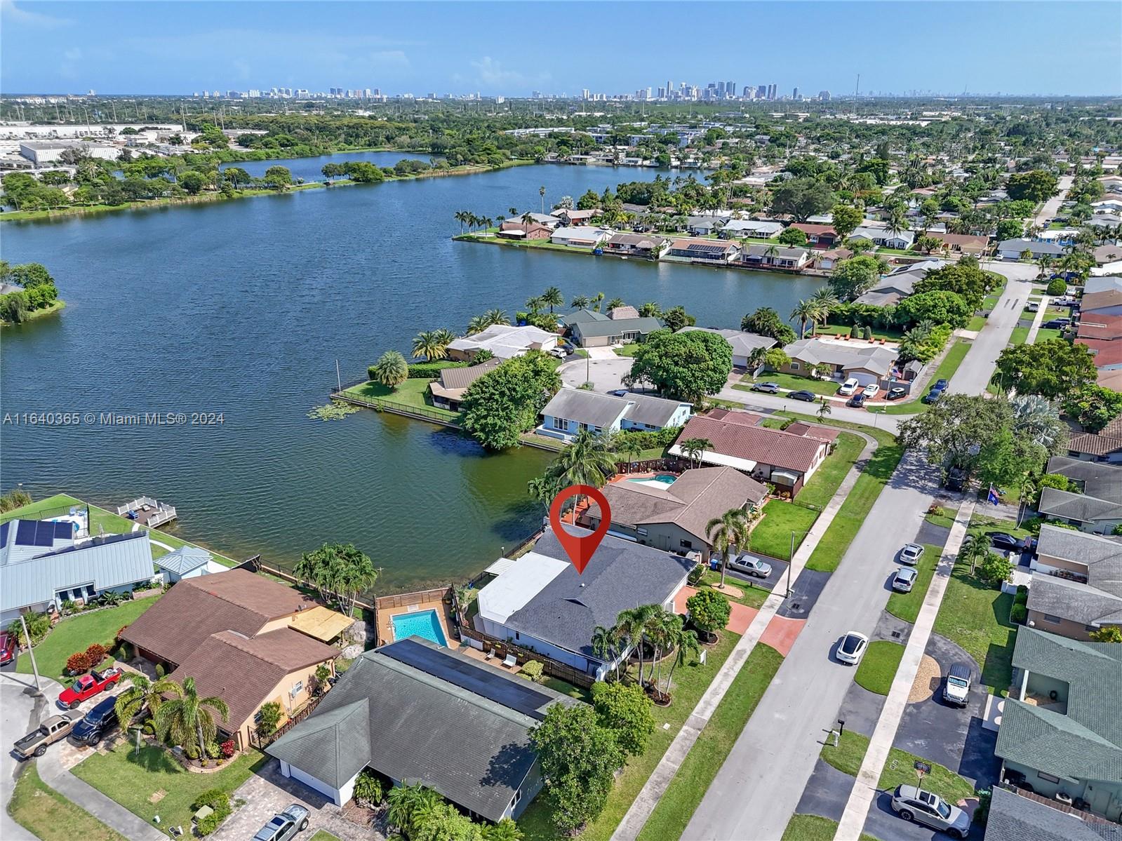 an aerial view of a house with a lake view