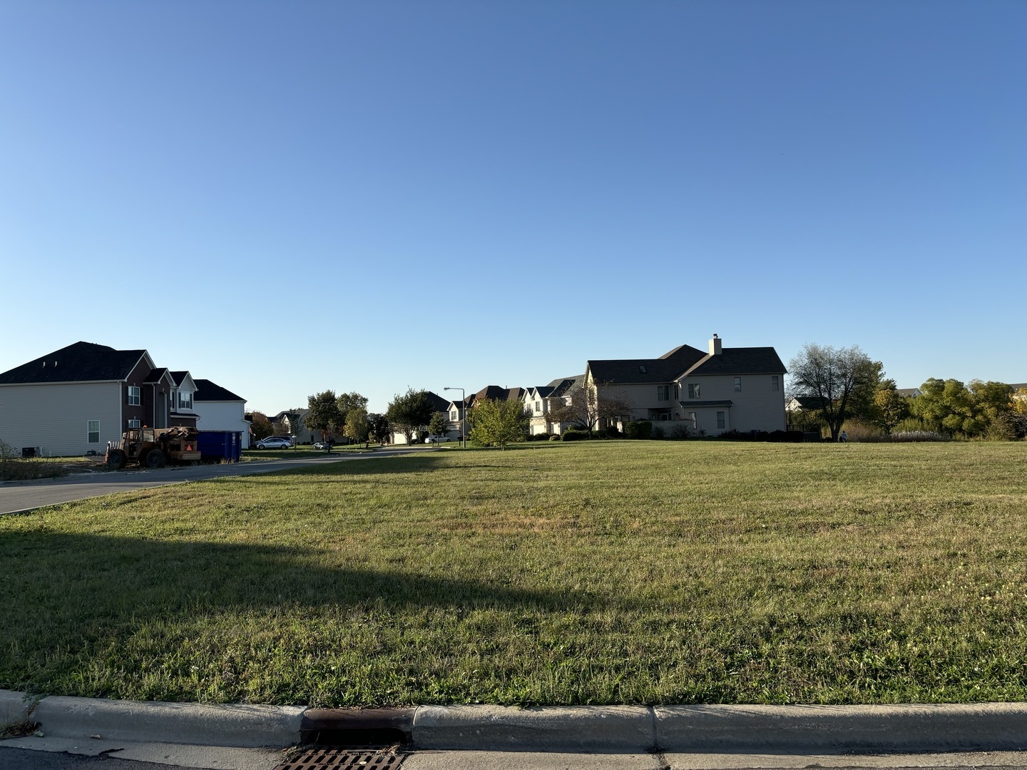 a view of a big yard with an outdoor seating