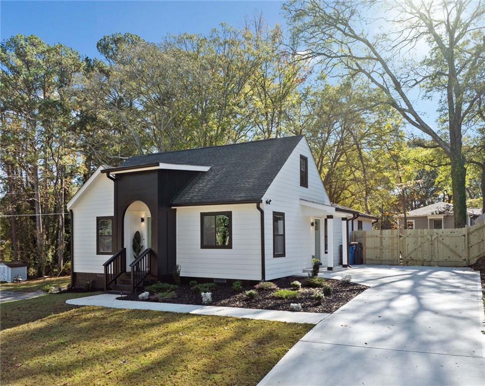 a front view of a house with garden