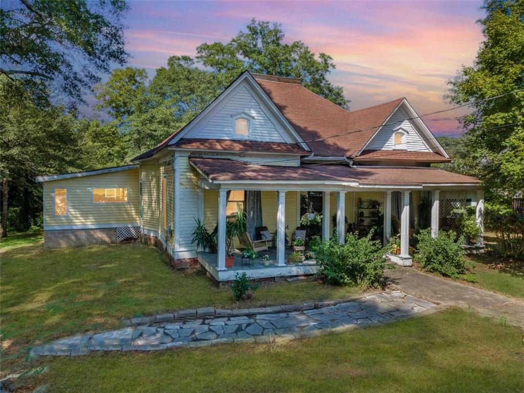 a front view of a house with garden