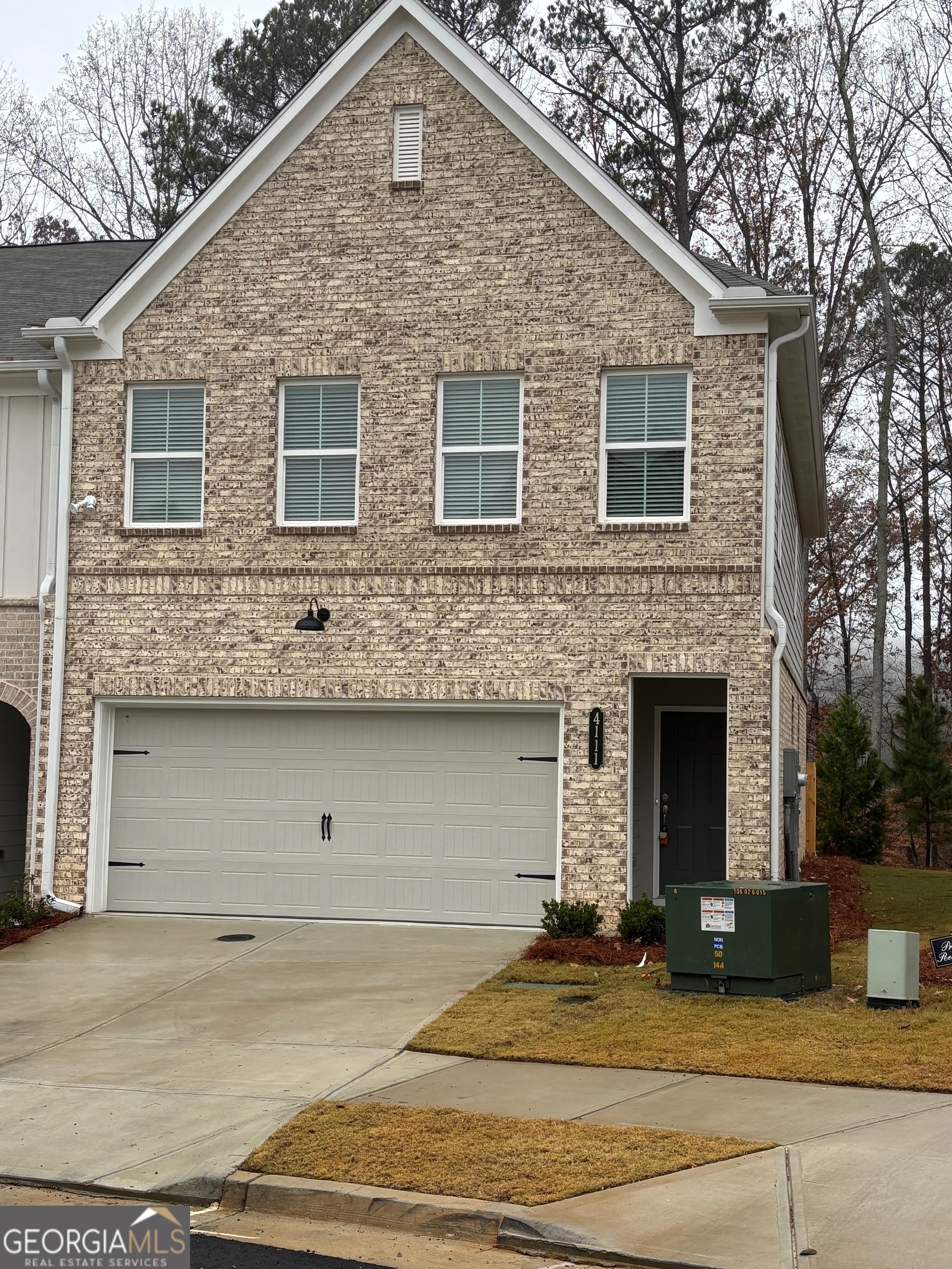 a front view of a house with yard