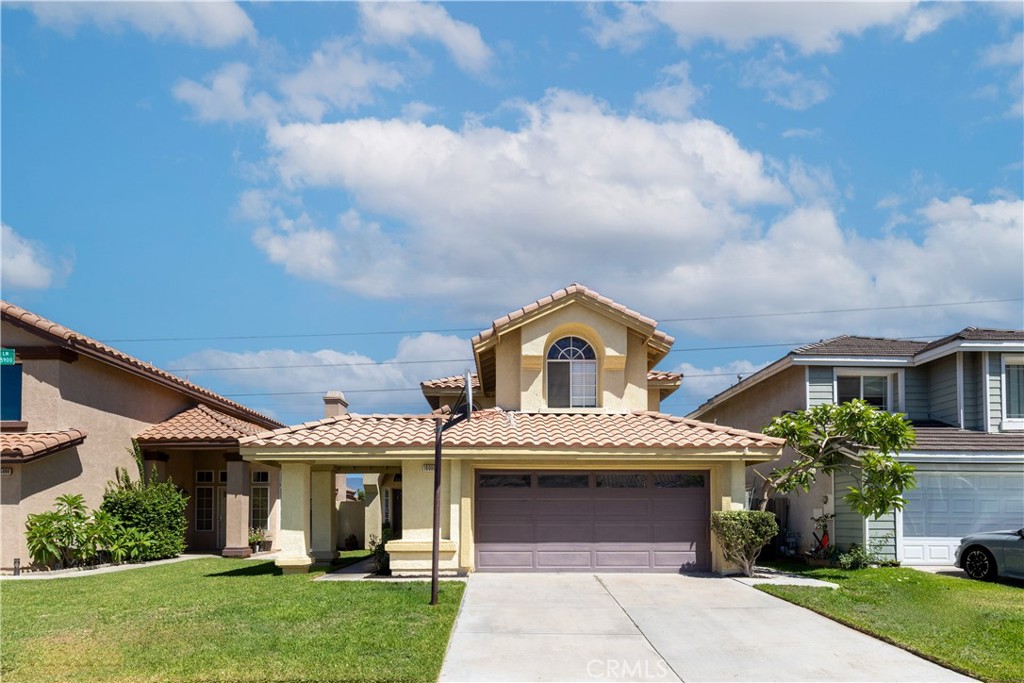 front view of a house with a yard