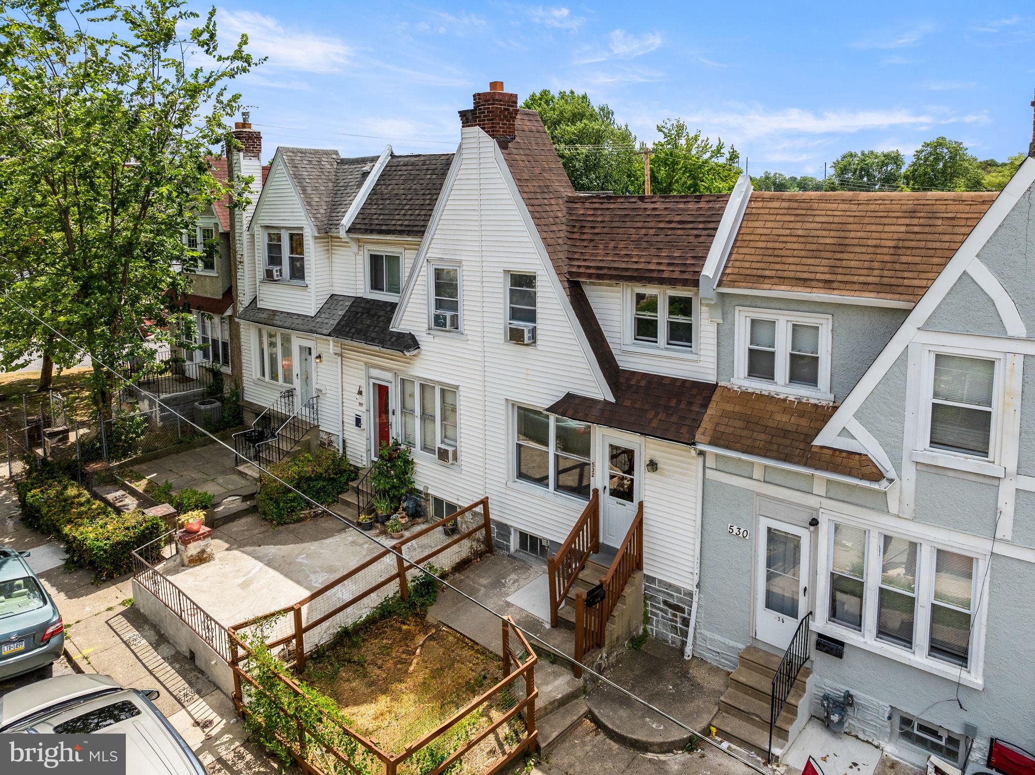 an aerial view of a house with sitting area