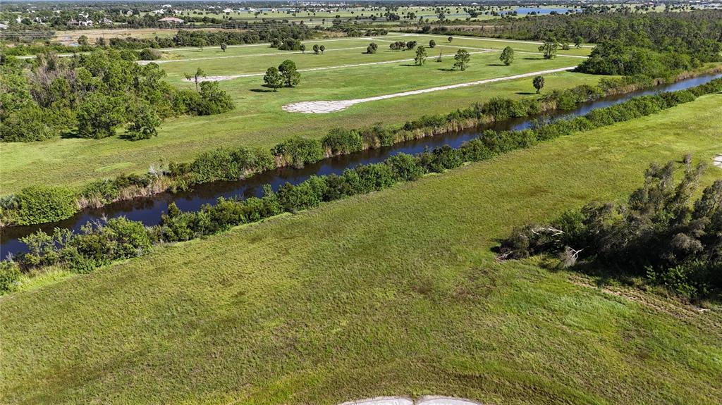 a view of a golf course with a lake