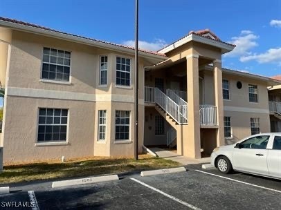 a view of a car park in front of a house