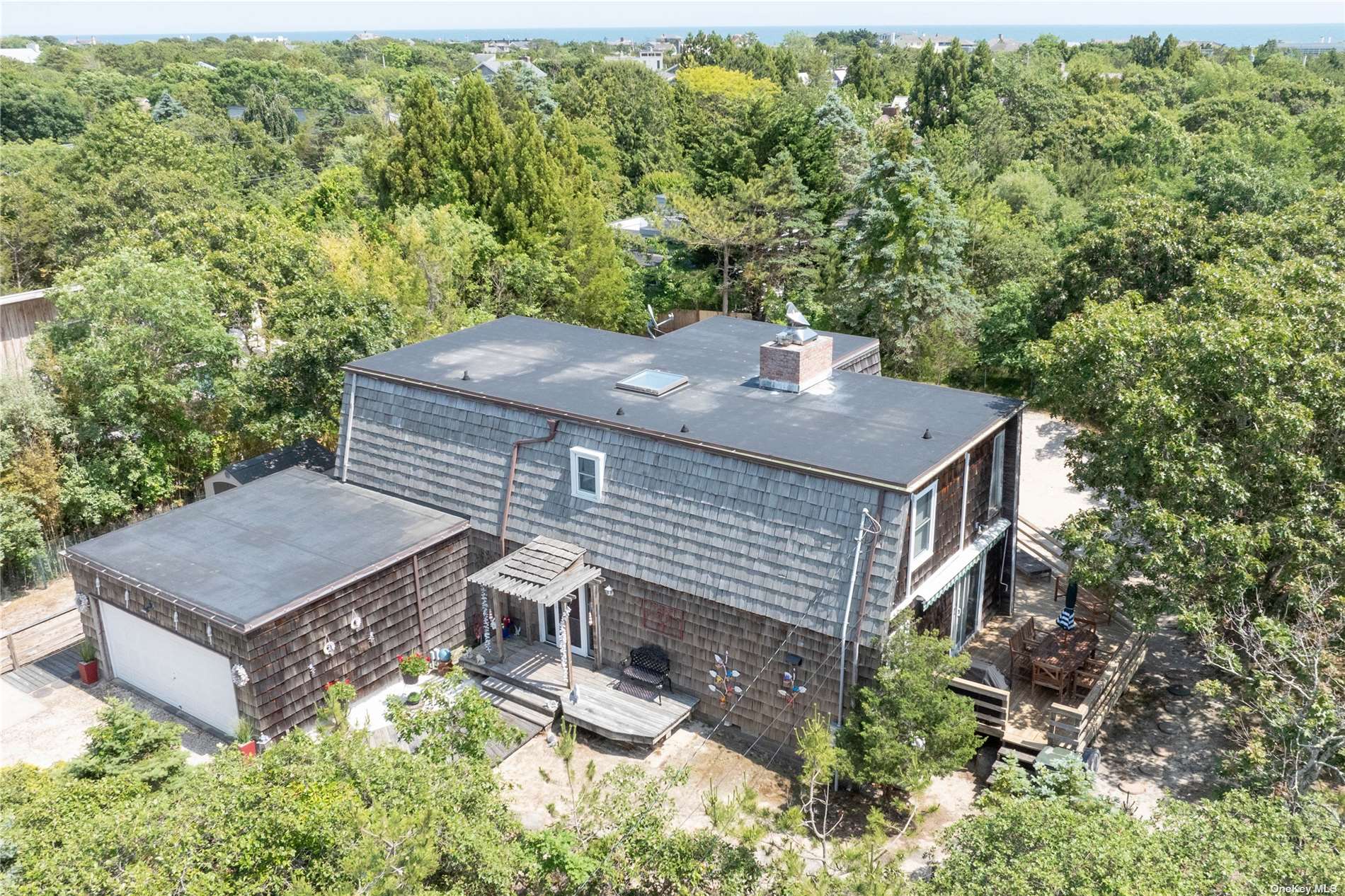 a view of a house with roof deck front of house