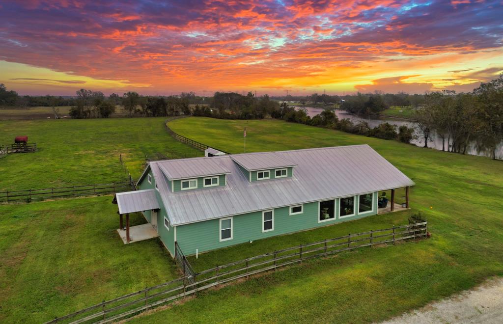 aerial view of a house with a big yard