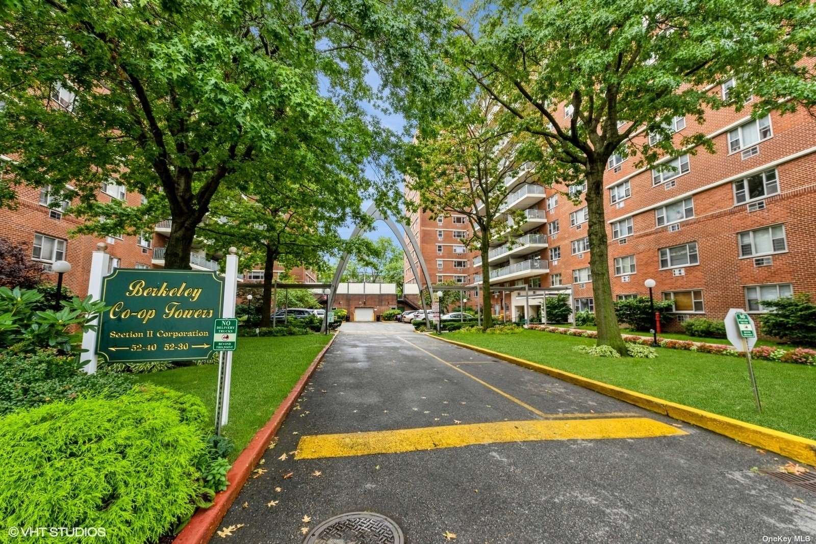 a view of a park with large trees