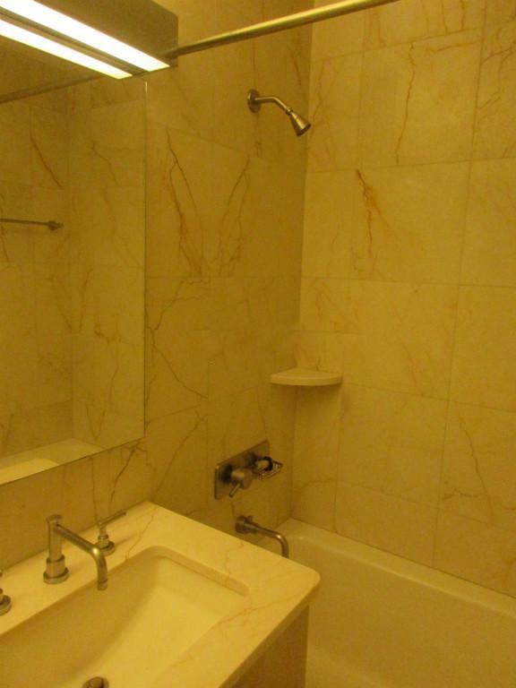 a bathroom with a sink and a bath tub