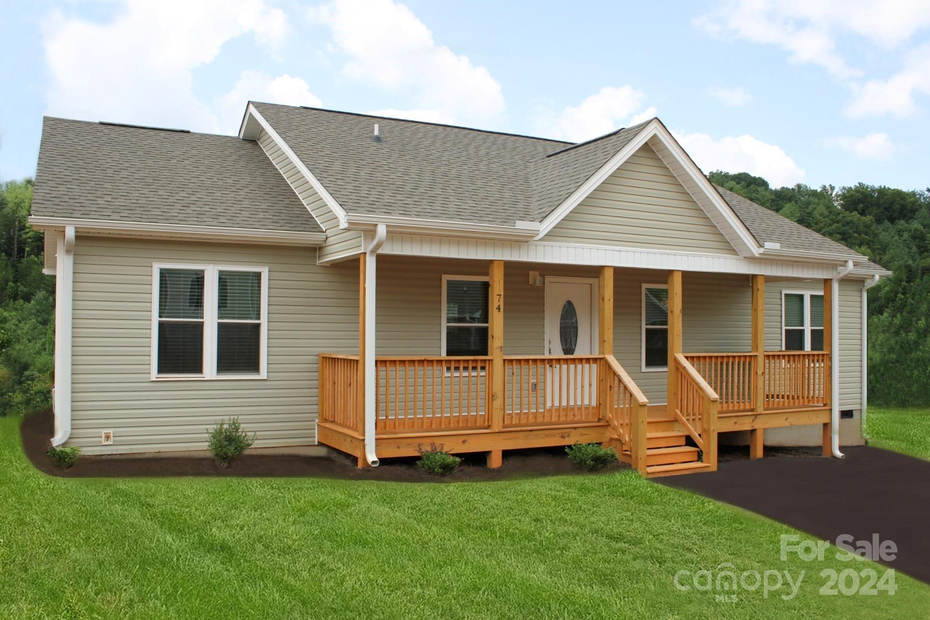 a view of house with backyard