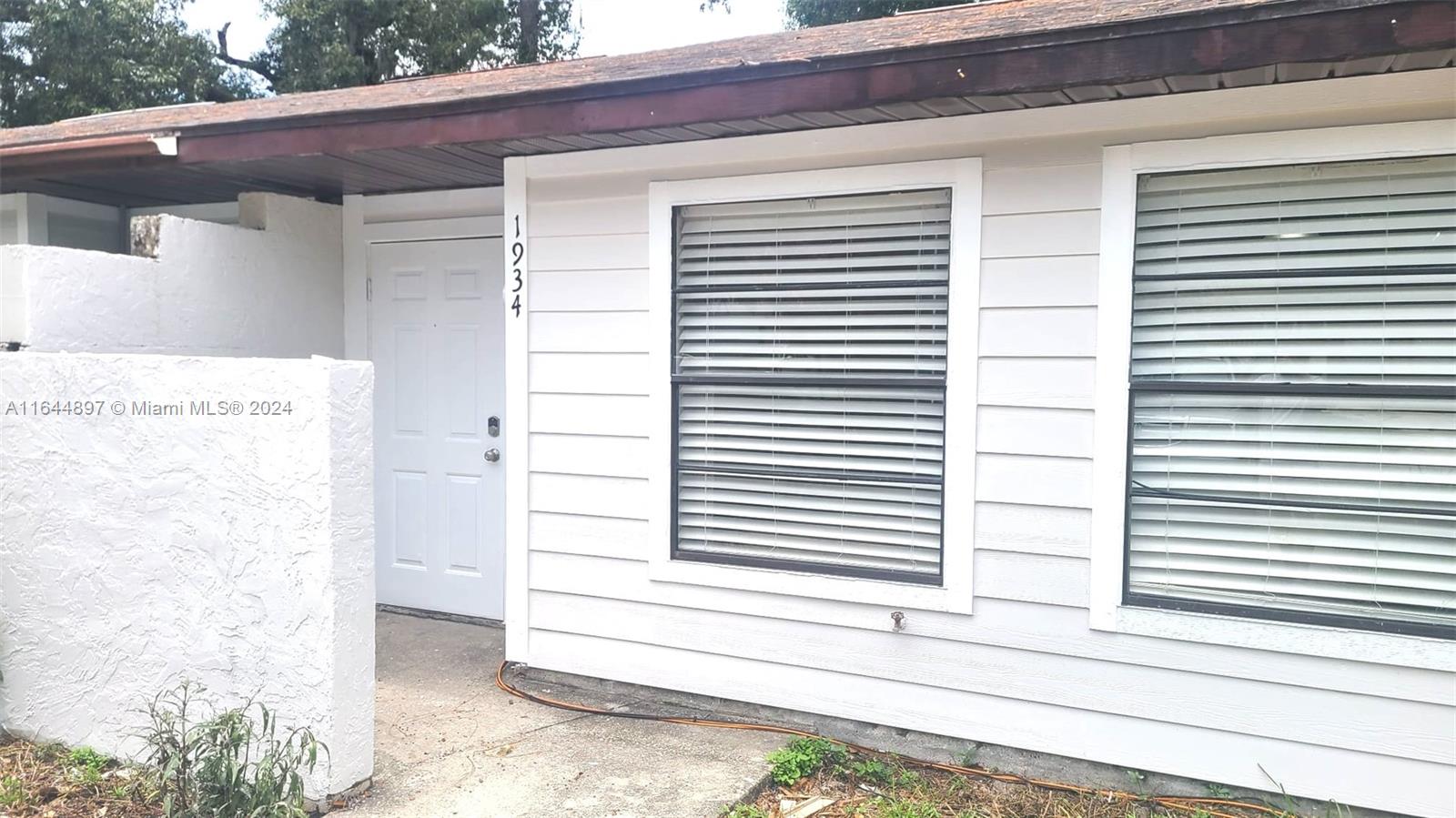 a view of a house with a white door