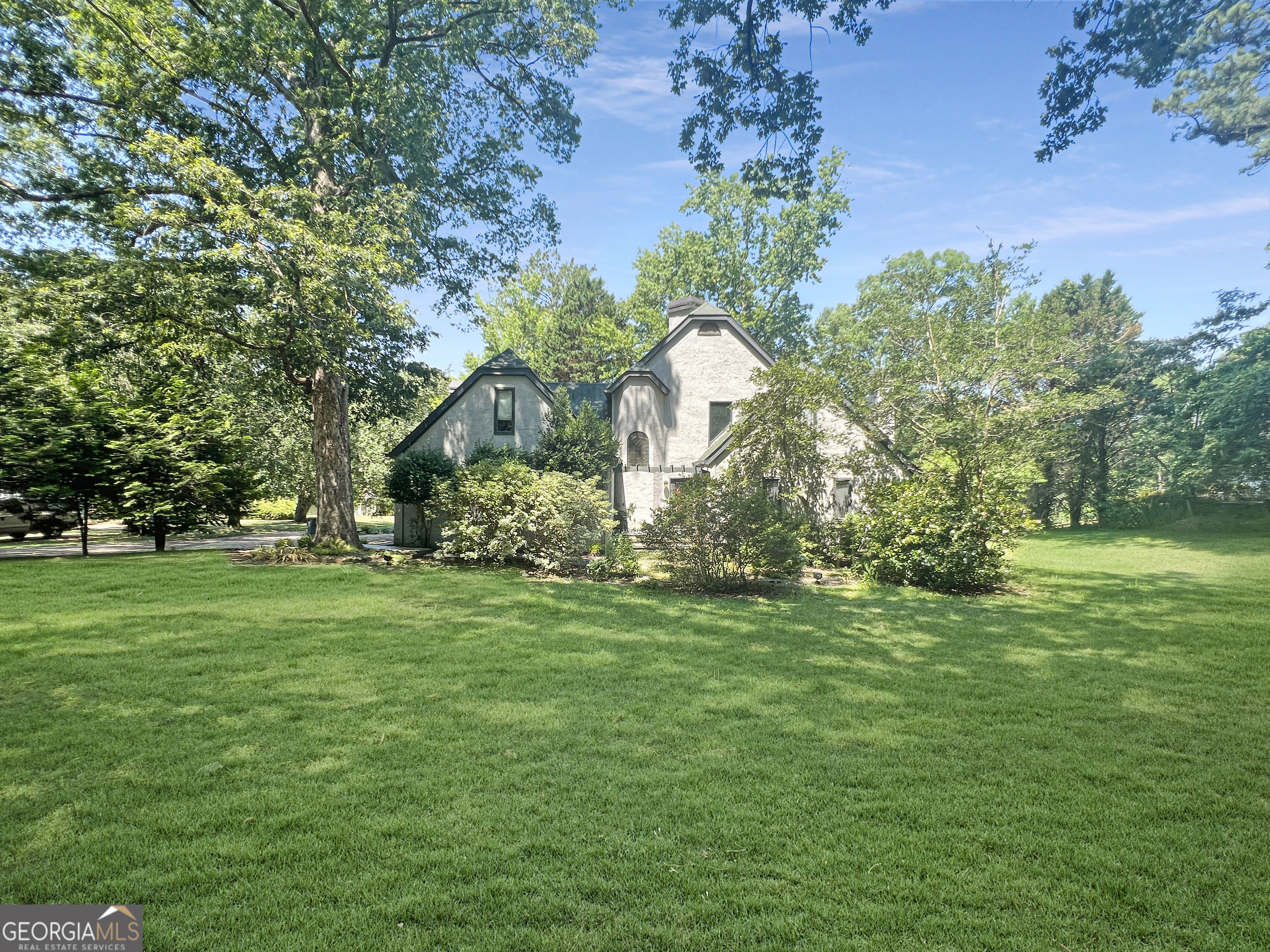 a backyard of a house with lots of green space