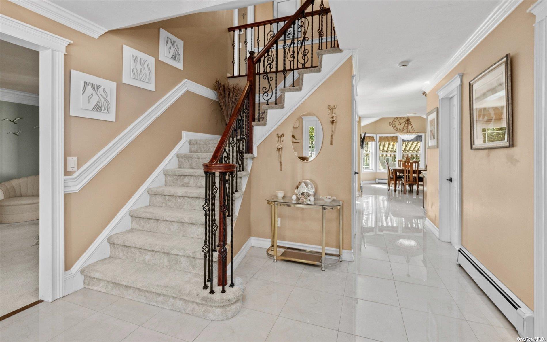 a view of entryway and hall with dining room