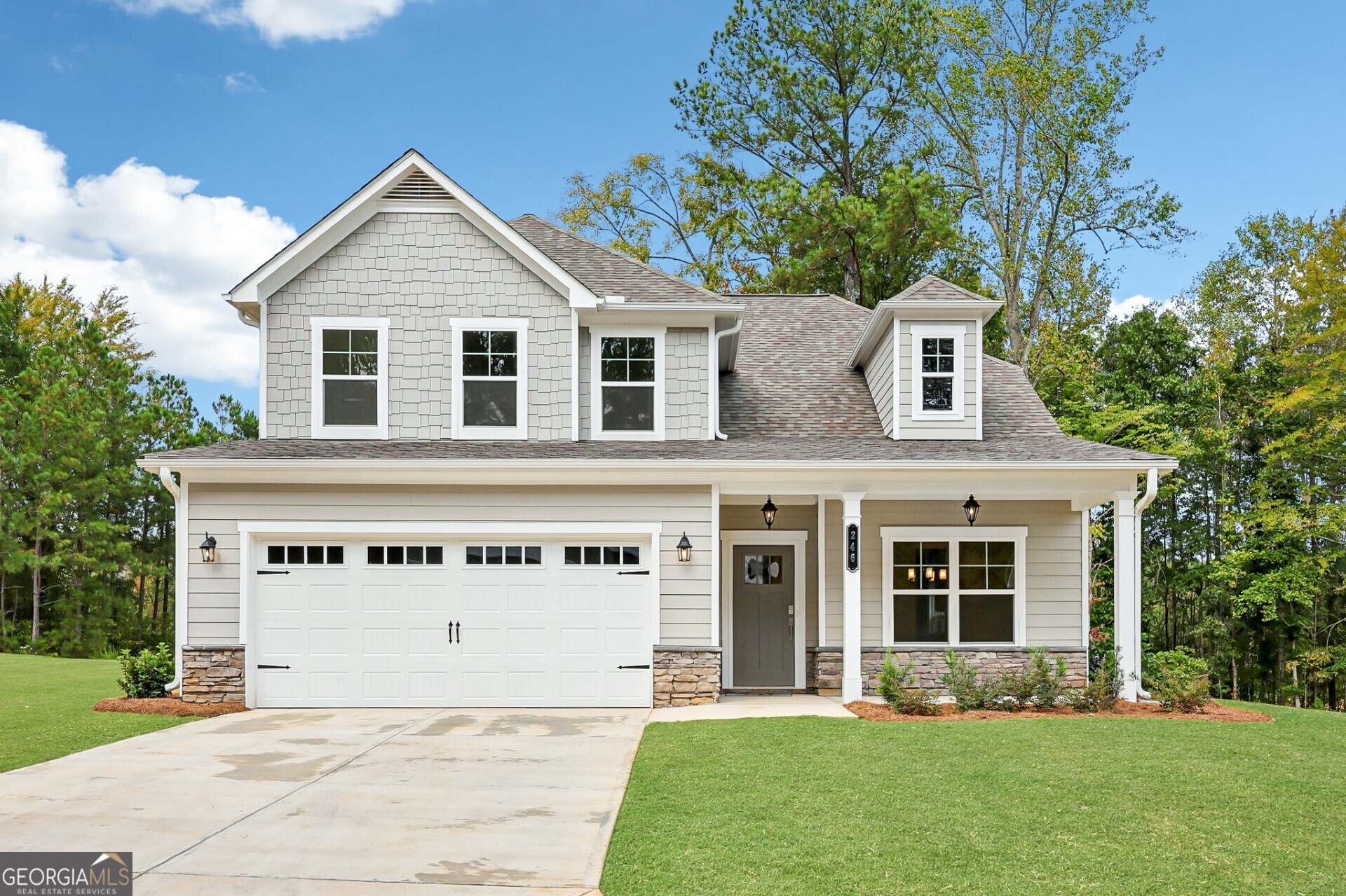 front view of a house with a yard