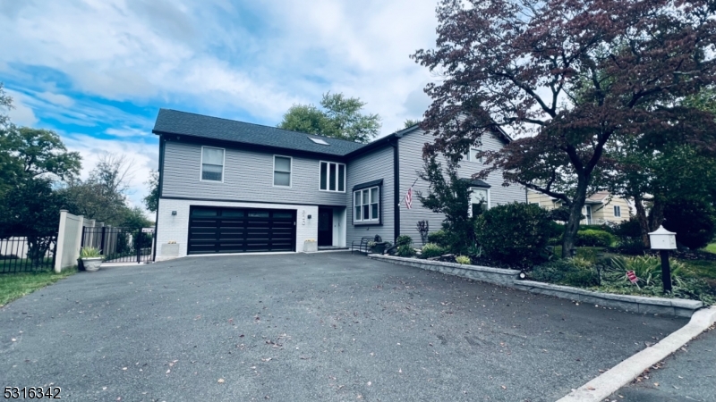 a view of a house with a garage