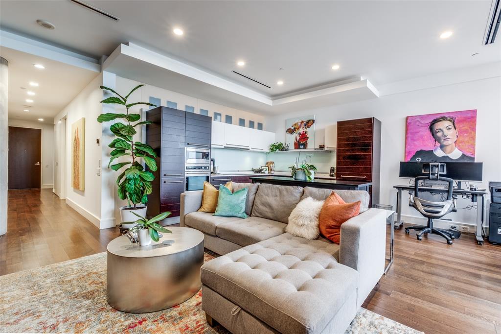 a living room with furniture and a potted plant