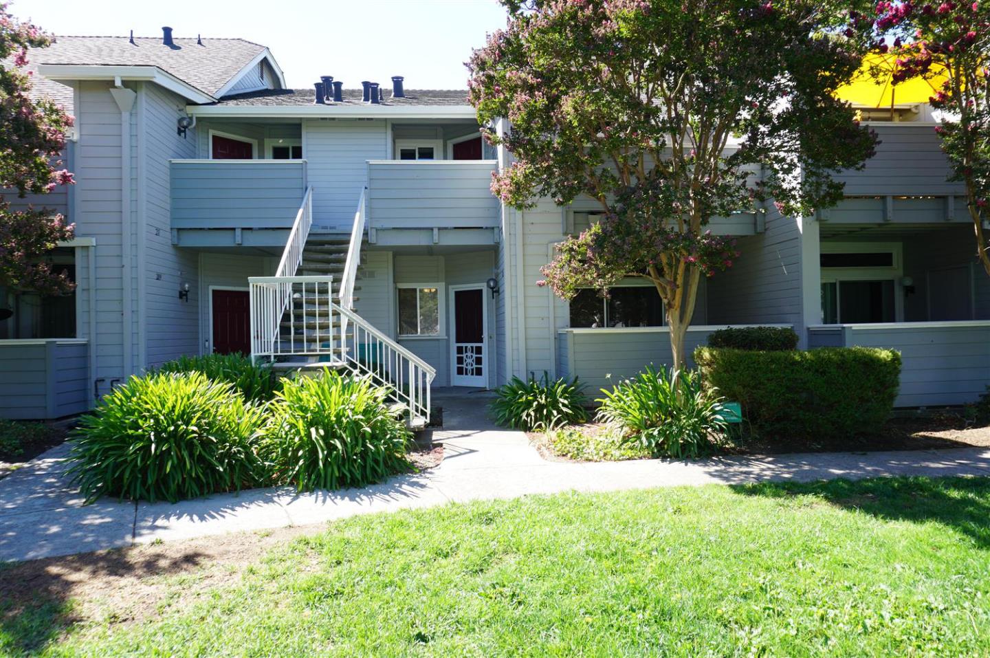 a front view of a house with garden