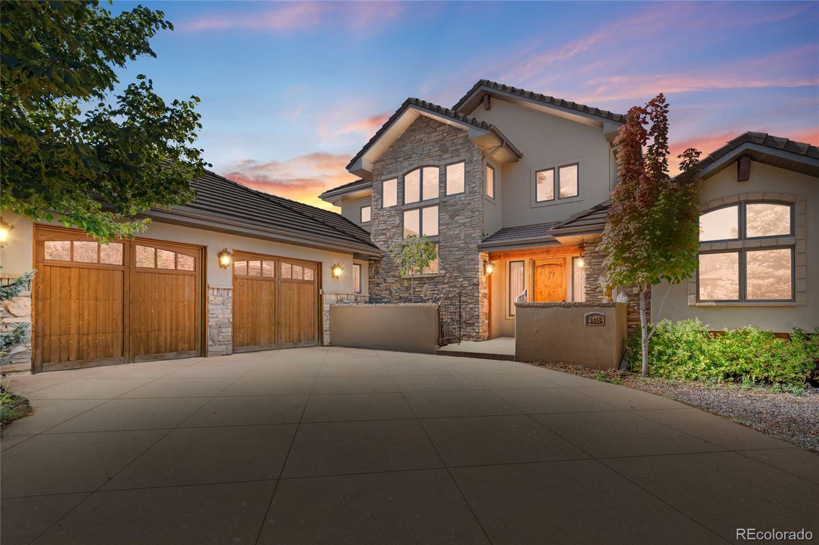 a front view of a house with a garage