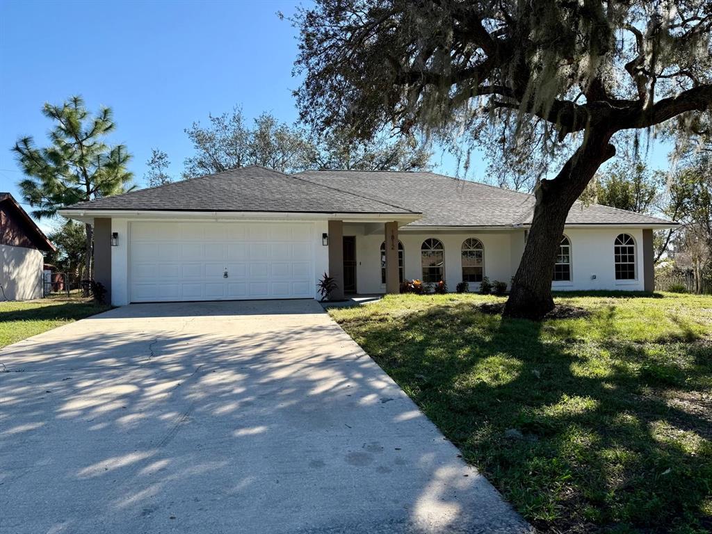 front view of a house with a yard