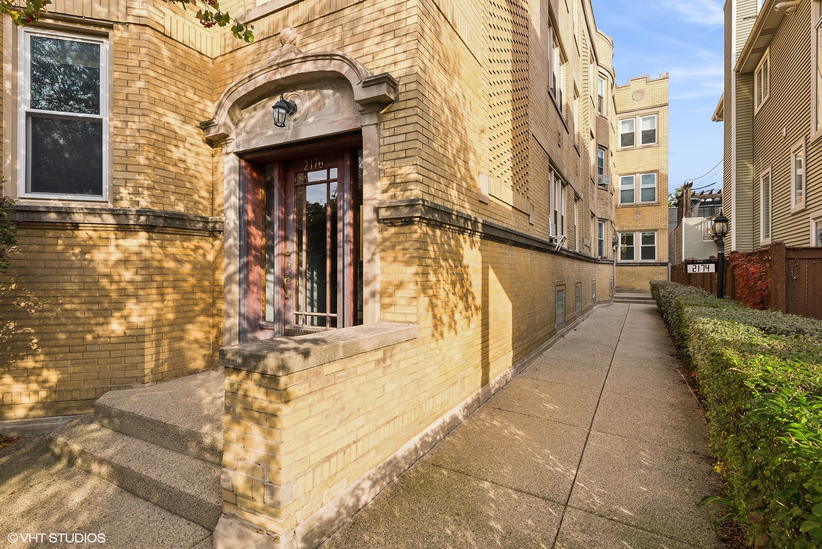 a view of a brick building with many windows