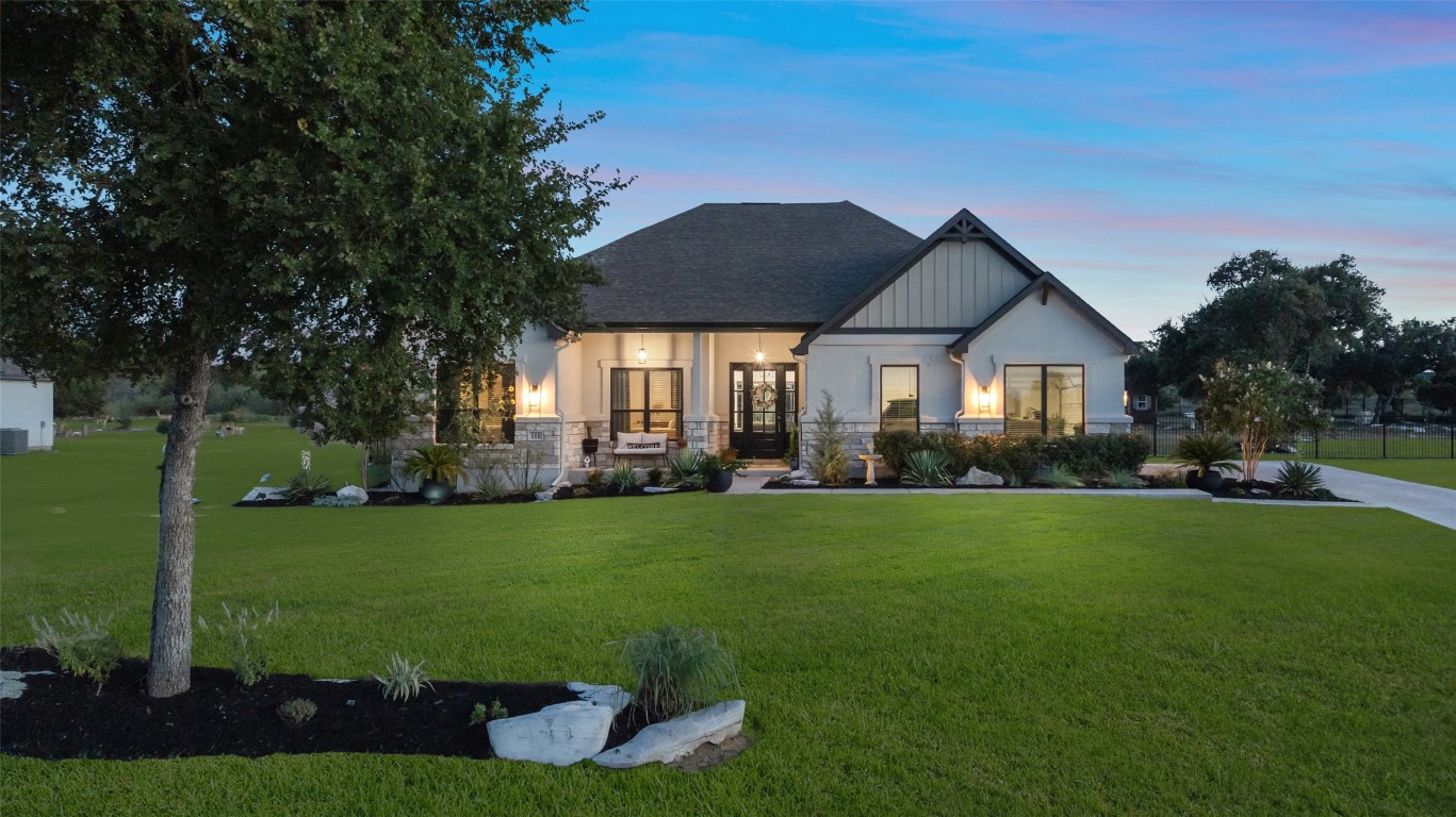 a front view of a house with a yard