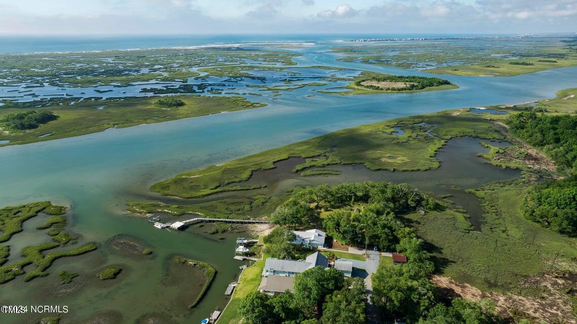 an aerial view of ocean with residential house and ocean view