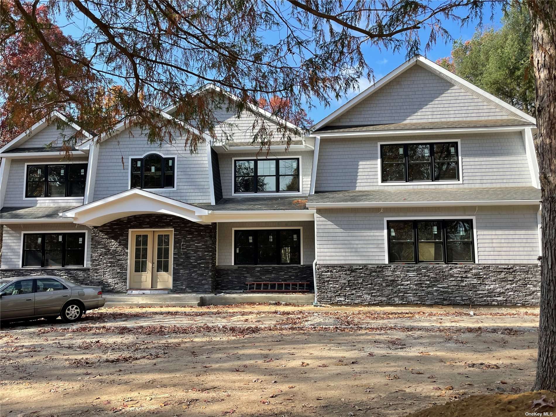 a front view of a house with a yard