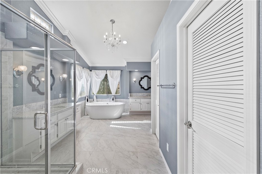 a bathroom with a tub shower and sink