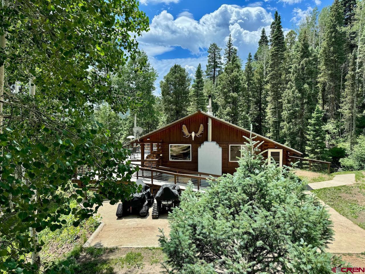 a house with trees in the background