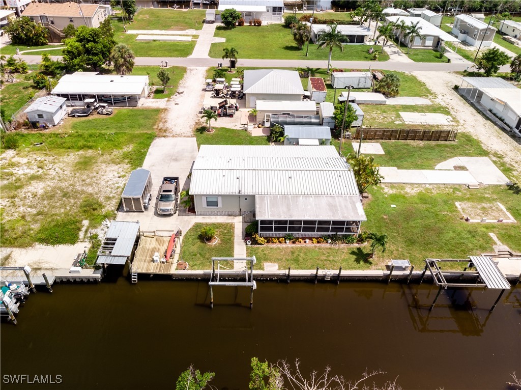 an aerial view of a house with a ocean view