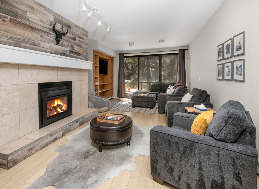 a living room with furniture and a fireplace