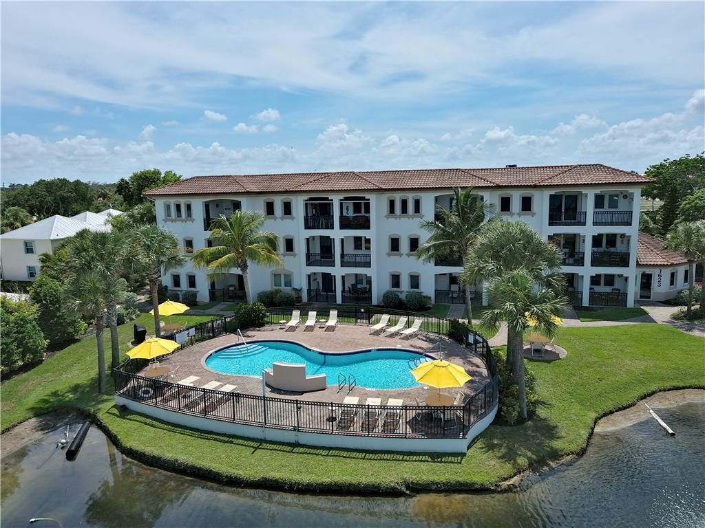 a swimming pool with outdoor seating yard and barbeque oven