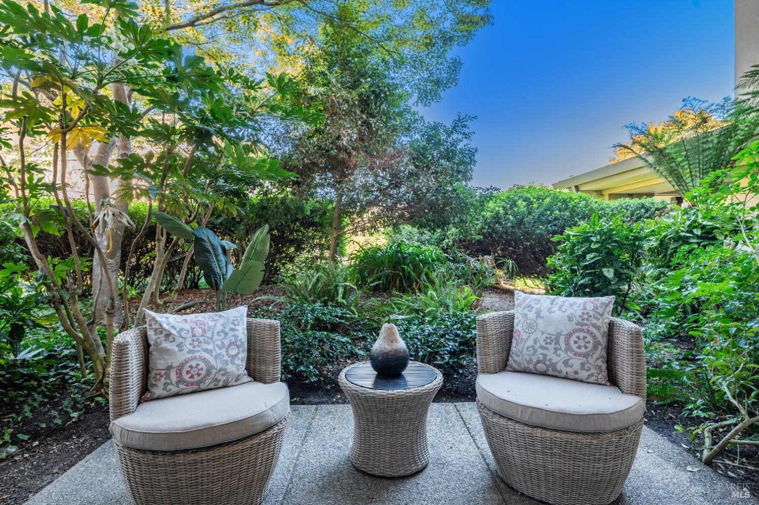 Imagine this view every day! Water fall feature heard in the background, lush greenery and lovely ground floor convenience.