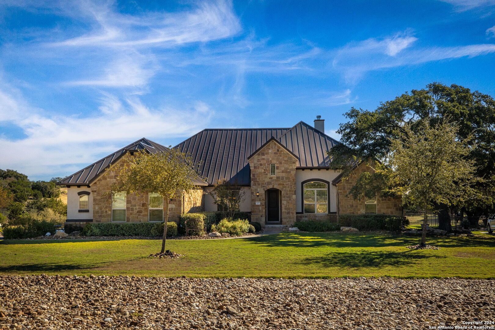 a front view of a house with a yard