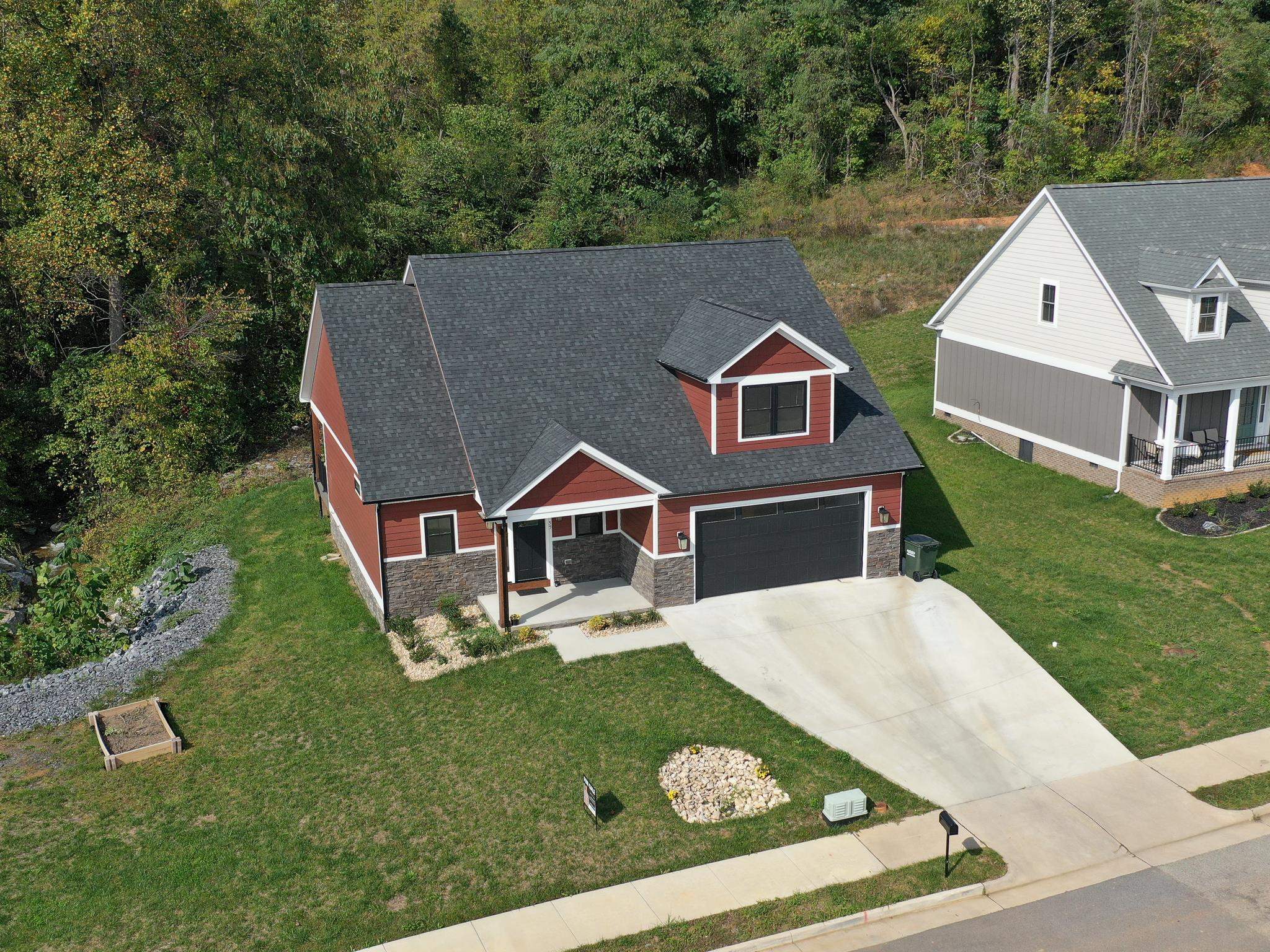 an aerial view of a house with swimming pool