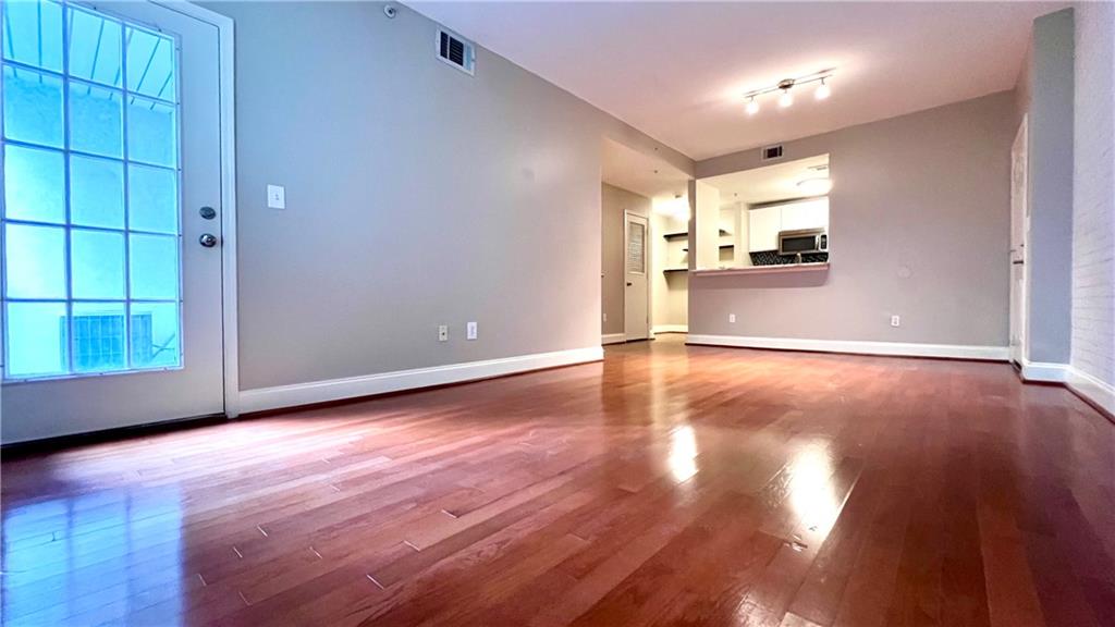 a view of a livingroom with wooden floor