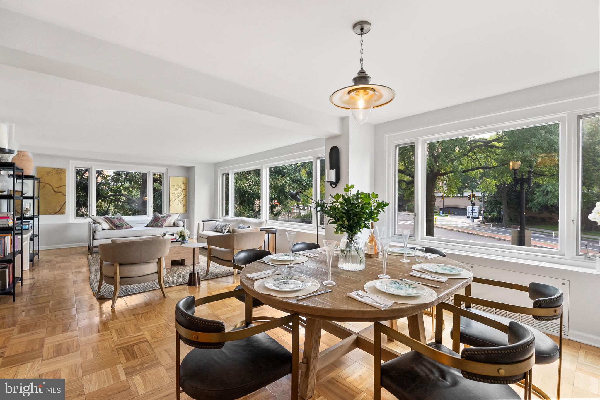 a view of a dining room with furniture window and outside view